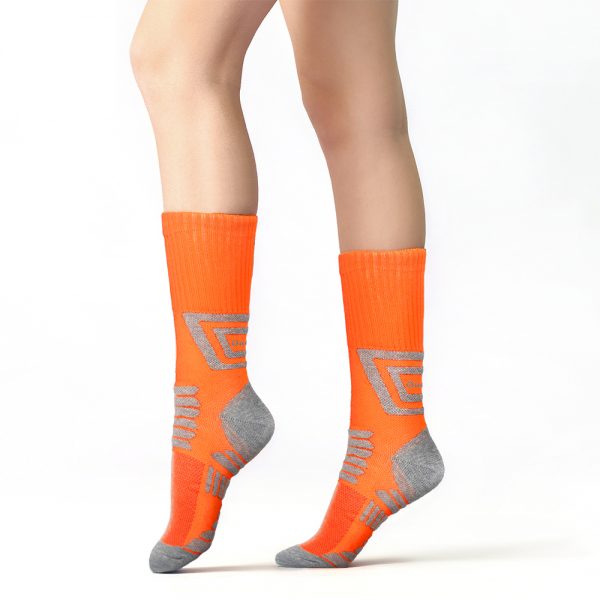 Legs,Of,Young,Woman,In,Socks,On,Color,Background