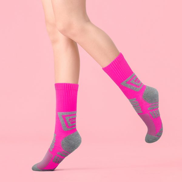 Legs,Of,Young,Woman,In,Socks,On,Color,Background
